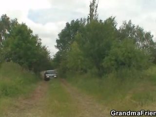 Old escort takes two cocks outside